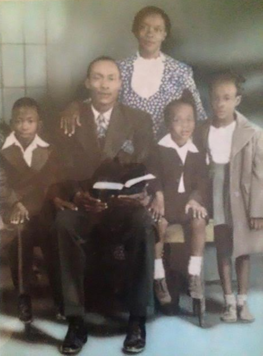 Charleston family photo, 1948. Watts Studio, 103rd and Anzac. Wajeha is eight years old and standing at the far right.