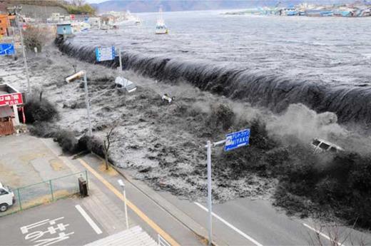 Figure 3. The Fukushima tsunami. A tsunami reaches Miyako City, overtopping seawalls and flooding streets in Iwate Prefecture, Japan, after the magnitude 9.0 earthquake struck the area on March 11, 2011. The tsunami disaster overwhelmed the survival capabilities of cities and towns along this coastline – but a warning already existed in the form of tens of memorial stones from the 16th and 17th centuries recalling past tsunami influxes. These stones suggested the likely level of inundation and hence the ‘safe’ threshold at which villagers could build or gather. Credit: Mainichi Shimbun, Reuters. DOI: https://doi.org/10.1525/elementa.364.f3