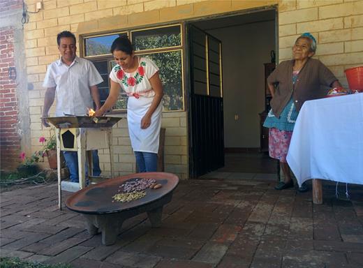 Figure 3. Tejate Preparation. The methods and techniques for making tejate are passed down from generation to generation, and a fiercely held practice and a dish crucial to the identity of the villagers. The cacao, Rosita de cacao and mamey seed must be roasted on the comal before they are ground. If not, the result is not ‘authentic’ tejate. Copyright Amy B. Trubek 2020. DOI: https://doi.org/10.1525/elementa.437.f3