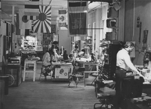 Billops and Hatch’s Eleventh Street loft, 1972. Hatch can be seen at his desk in front; Billops is in the back, working on her ceramics. Photo Credit: The Hatch Billops Collection.