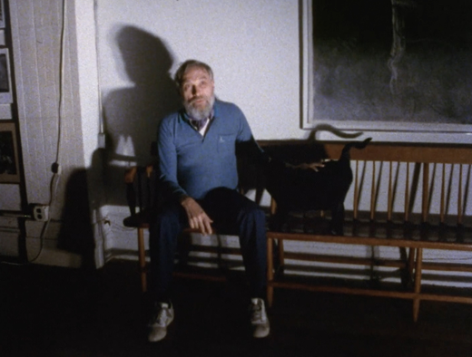 Still capture from Older Women and Love, featuring James V. Hatch and pet cat Shango.