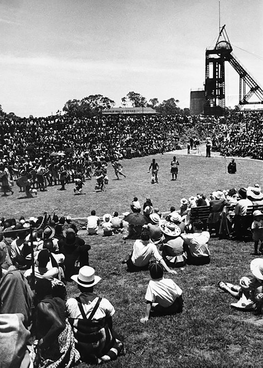Mine dance in an arena designed by Hugh Tracey at the Consolidated Main Reef Mine, Johannesburg. International Library of African Music (Republic of South Africa), ILM00428_151. Used with permission.