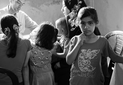 A Family being treated in one of the mobile clinics of the Palestinian Medical Relief Society in Bayt Hanun. (2015, photo by the author)