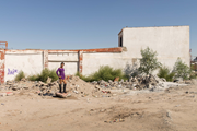 Pista de baile del club “Ruv”, 2016, color print on cotton paper, 120 x 180 cm. Transgender sex worker, Karla Ivonne, standing on the dance floor of a demolished club in Ciudad Juárez (photograph provided by the artist and Galerie Peter Kilchmann, Zurich)