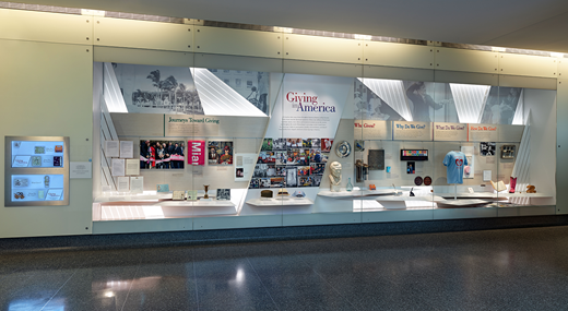 The National Museum of American History’s Giving in America exhibit as seen in 2023. The objects in “Journeys Toward Giving” highlight the story of the Cuban American cultural philanthropist Jorge Perez, who made a transformative gift to the Miami Art Museum in 2013. A sidebar features the fundraising efforts of a Mexican American hometown association in Chicago in the 1980s. (National Museum of American History)